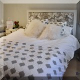 F33. Queen bed with upholstered headboard. 49”h 